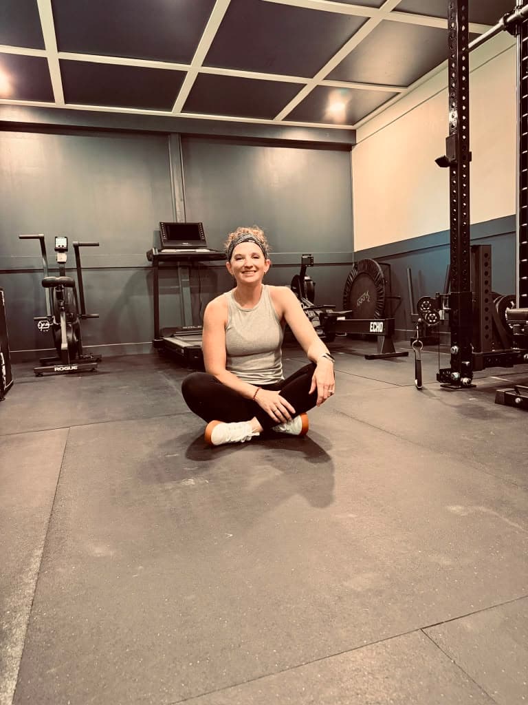 Tabby coaching a strength session at Optimal Wellness Clinic